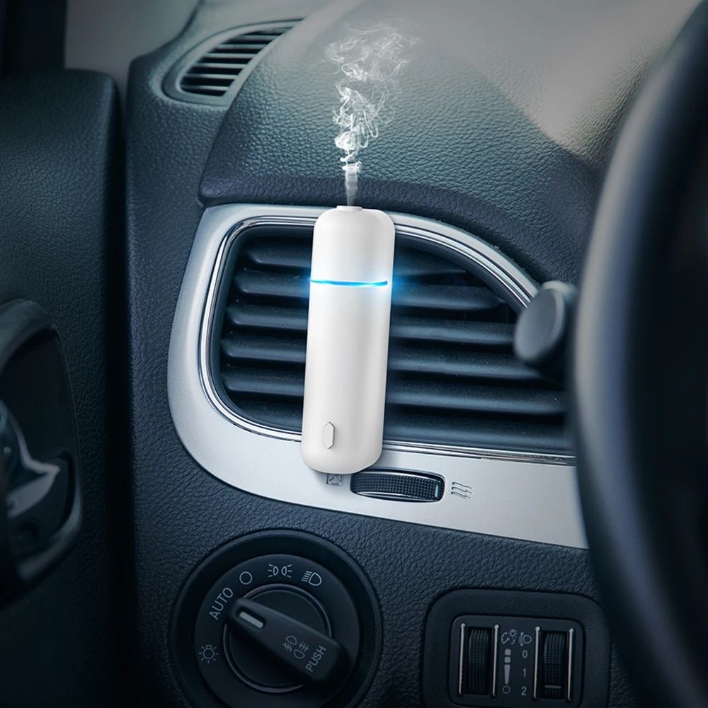 Luxurious Aroma Journey: Electric Waterless Car Perfume Diffuser with Vent Clip